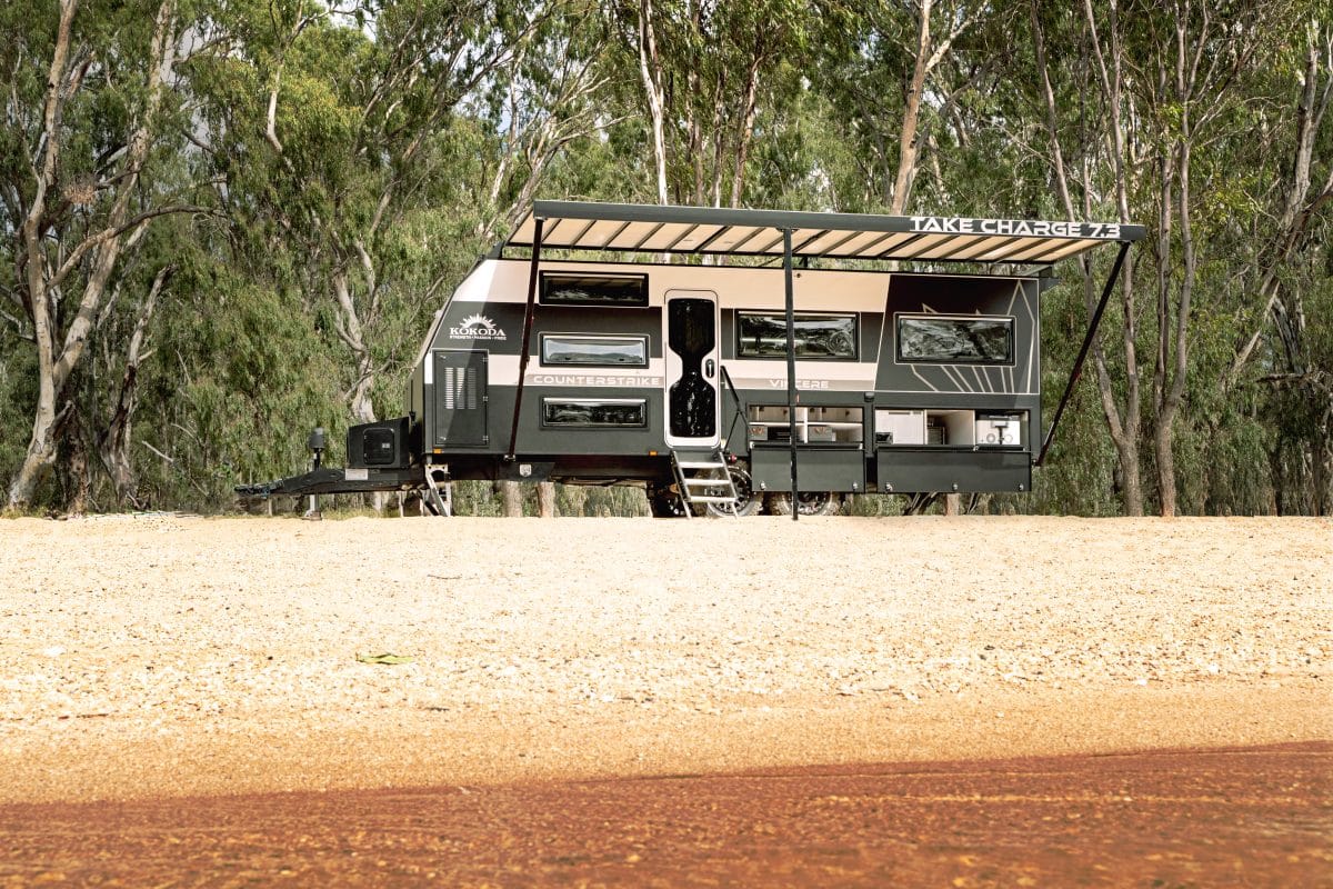 kokoda caravan counterstrike vincere on beach near river