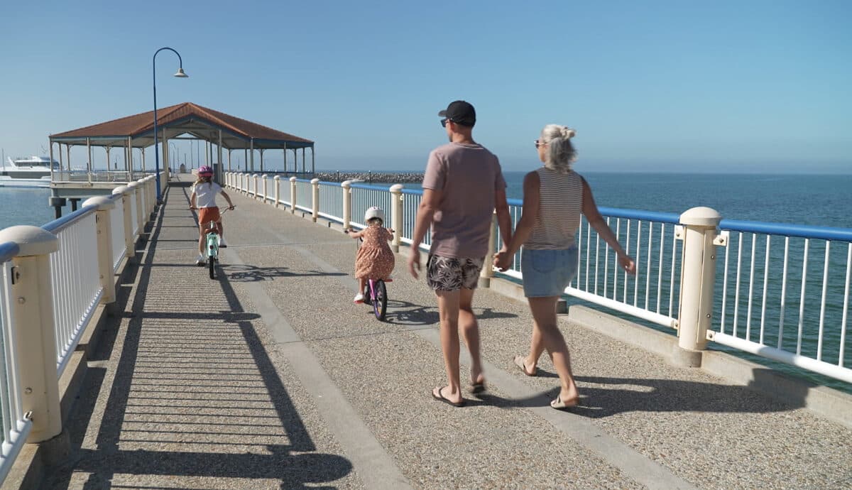 Walking down the a pier in  Scarborough Qld