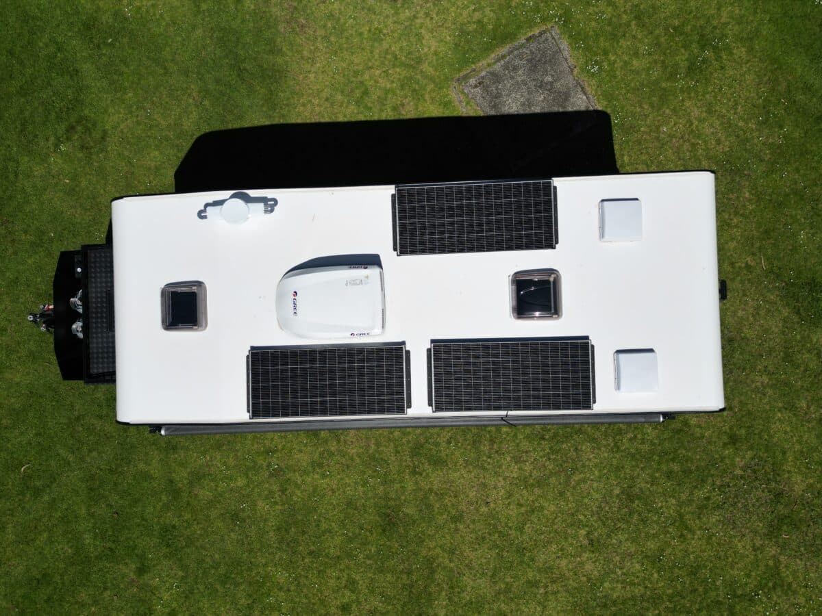 Aerial view of the Design RV one piece rear, roof and front shape. Note the 660W of solar up top, Gree air-conditioning system.