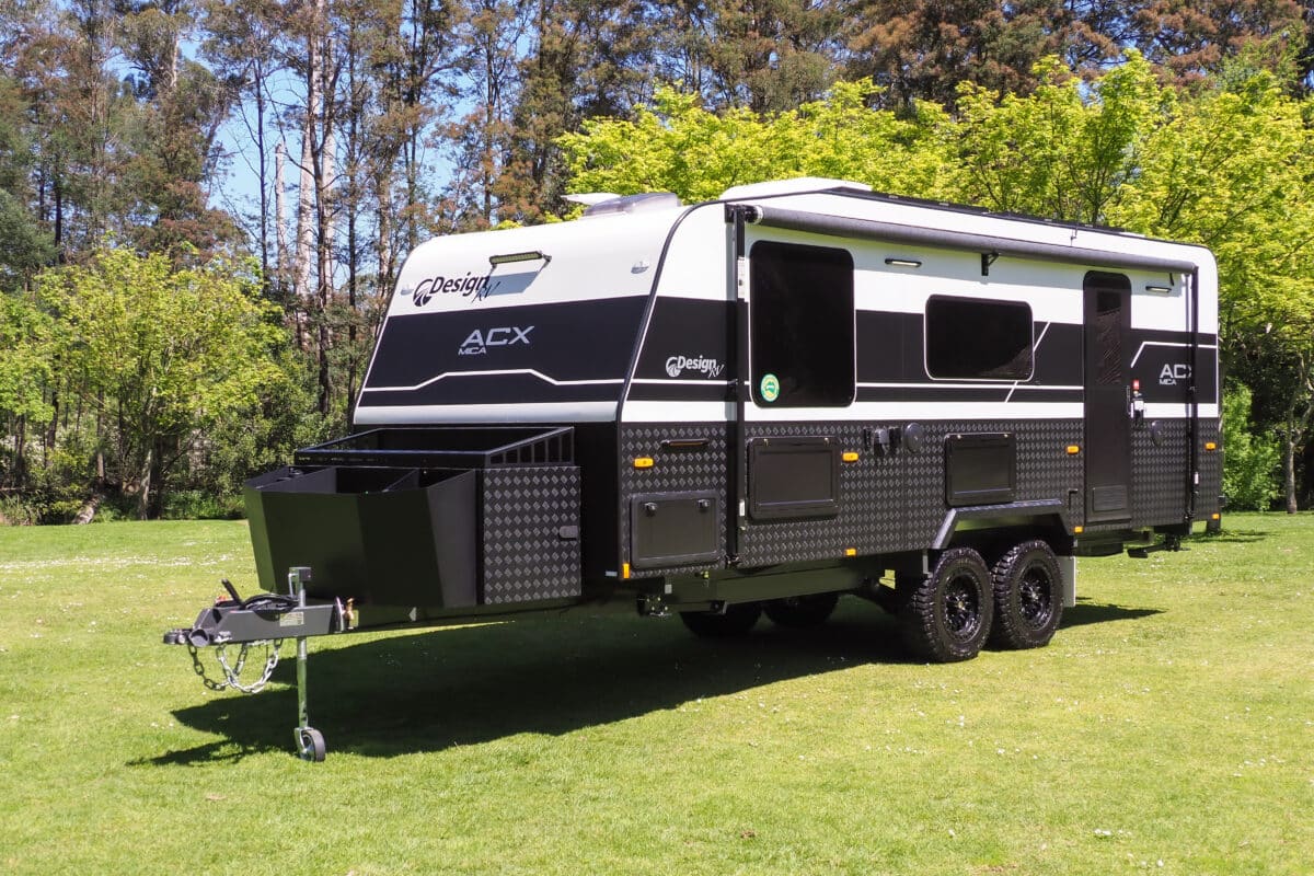Quietly confident, the Design RV shod in sturdy checkerplate features a handy toolbox up front with a firewood tray, slide-out and deep vessels for greater strength. Note the two picnic tables and tunnel boot.