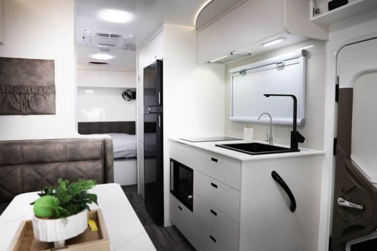 JB Touring motorhome, one of 7 layouts available. this model has an east-west bed in the rear. It closes off from the main quarters for privacy
