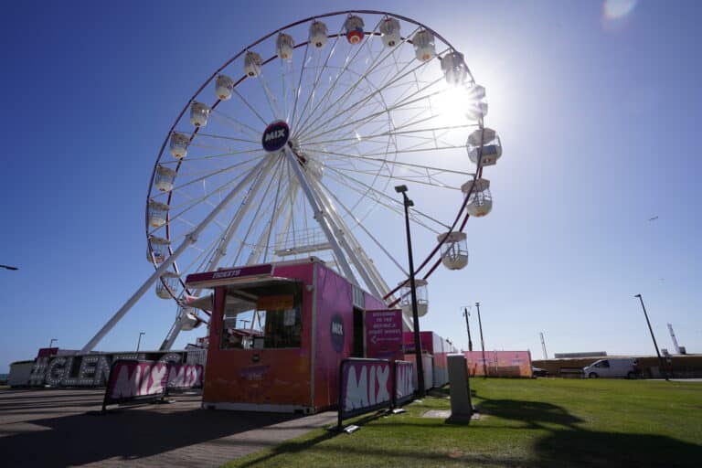 The giant Ferris wheel on the Glenelg foreshore against a bright blue sky