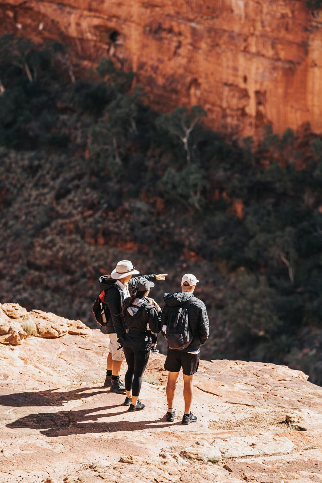 Three intrepid hikers peer into the abyss at Kings Canyon