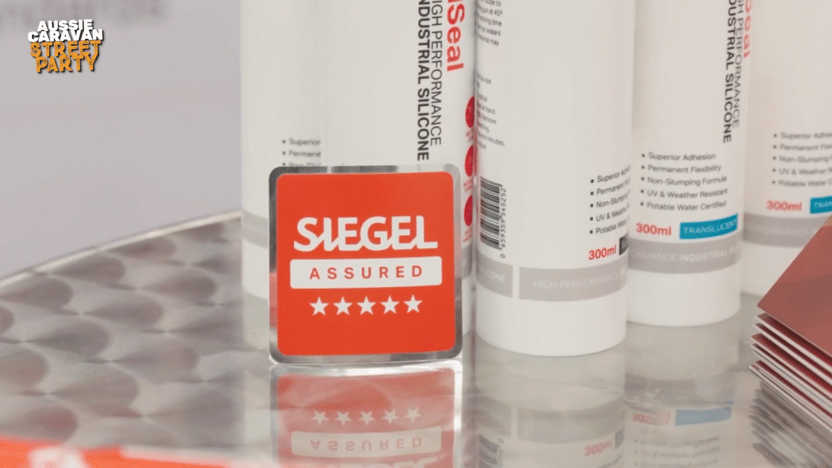 A close up of the red Siegel Assured badge identifying vans sealed using Siegel Adhesive according to the manufacturer protocol
