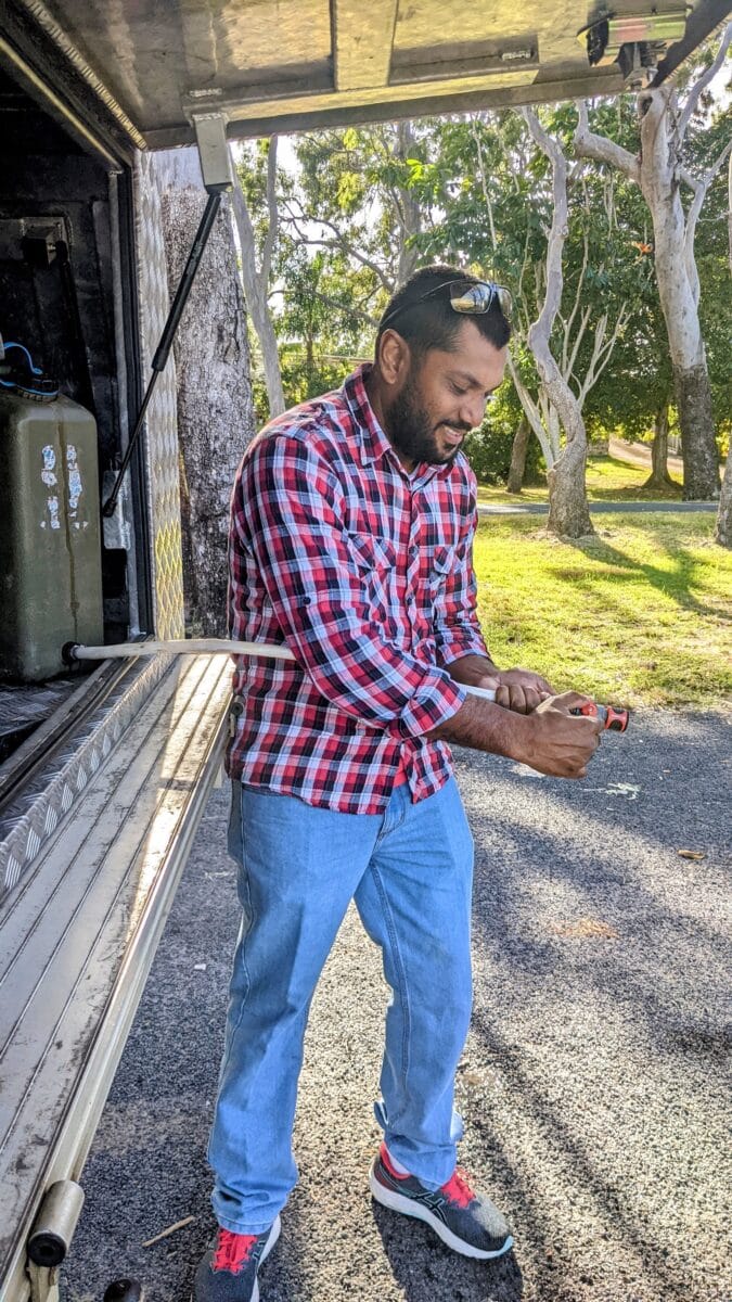 13mm hose extension connected to a jerry can for easy water access in storage.
