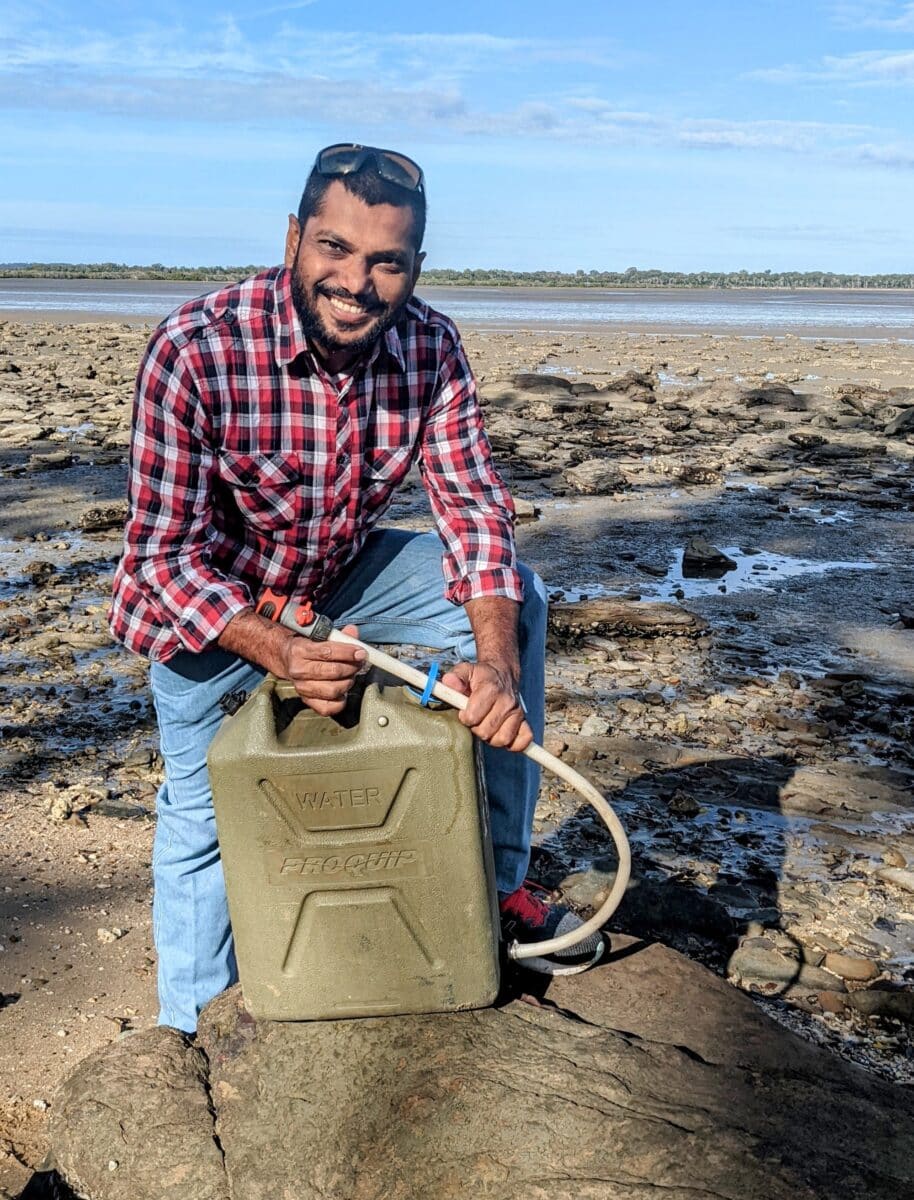 DIY jerry can water hack with hose attachment for remote beach camping
