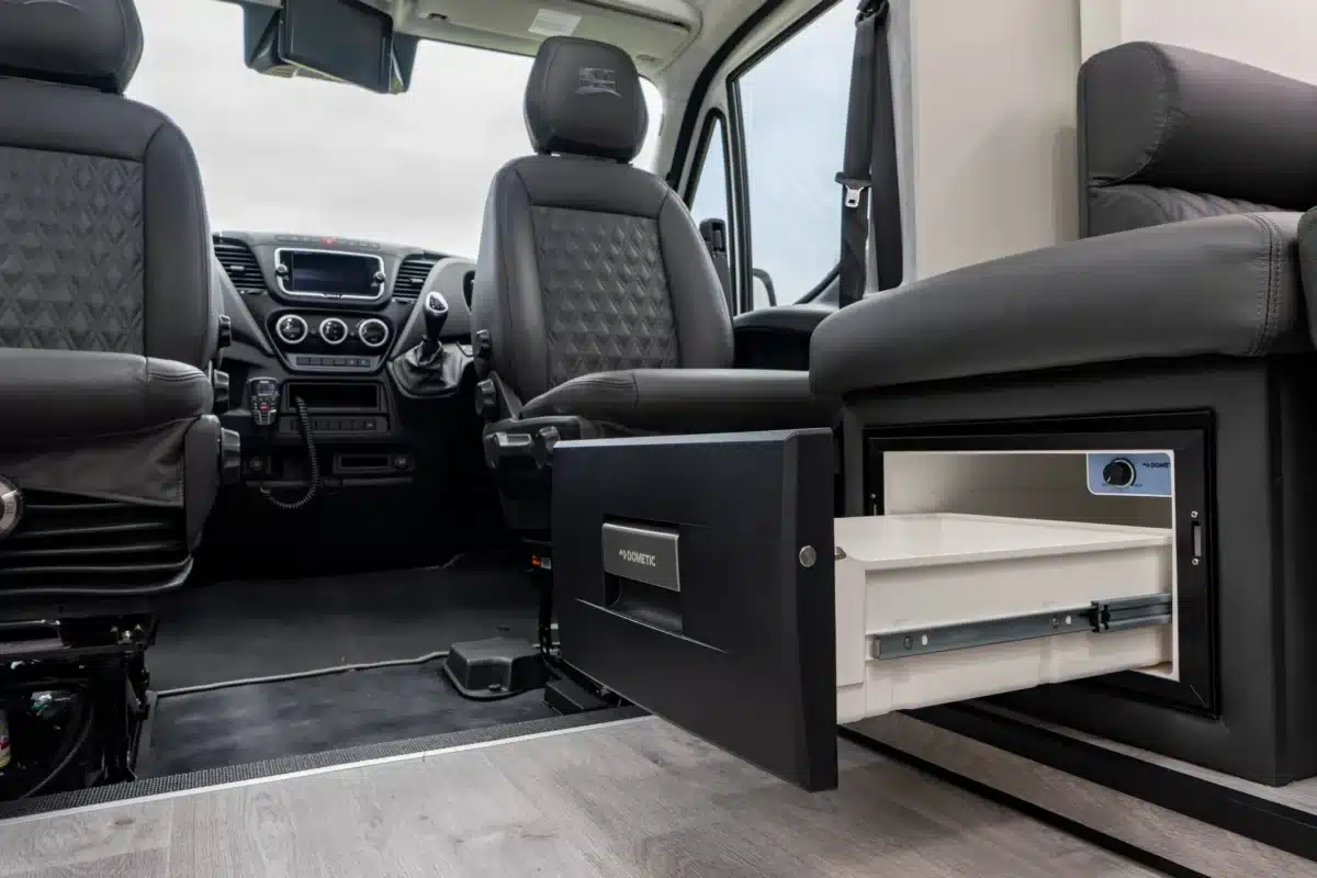 Front seating area of the Paradise Independence Platinum motorhome with integrated drawer storage