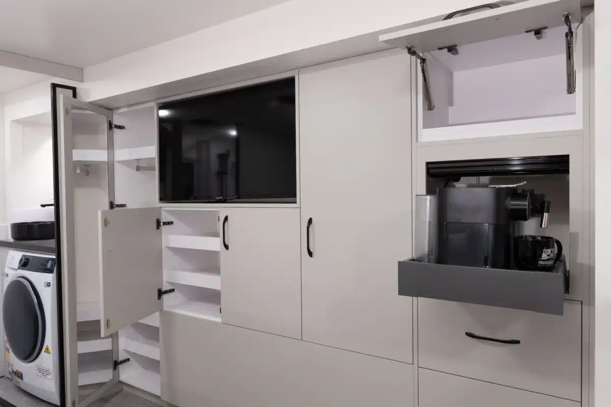 Kitchen appliance and storage wall in the Paradise Independence Platinum motorhome