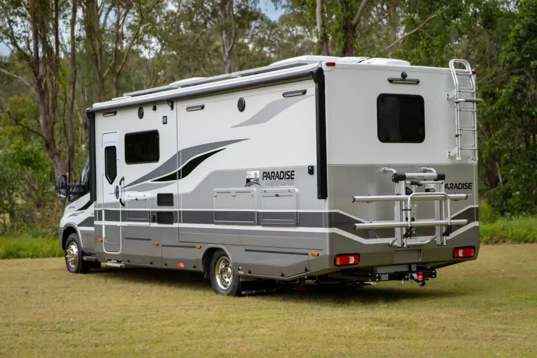 paradise-independence-platinum-rear-three-quarter Rear three-quarter view of the Paradise Independence Platinum motorhome showing storage and rear design