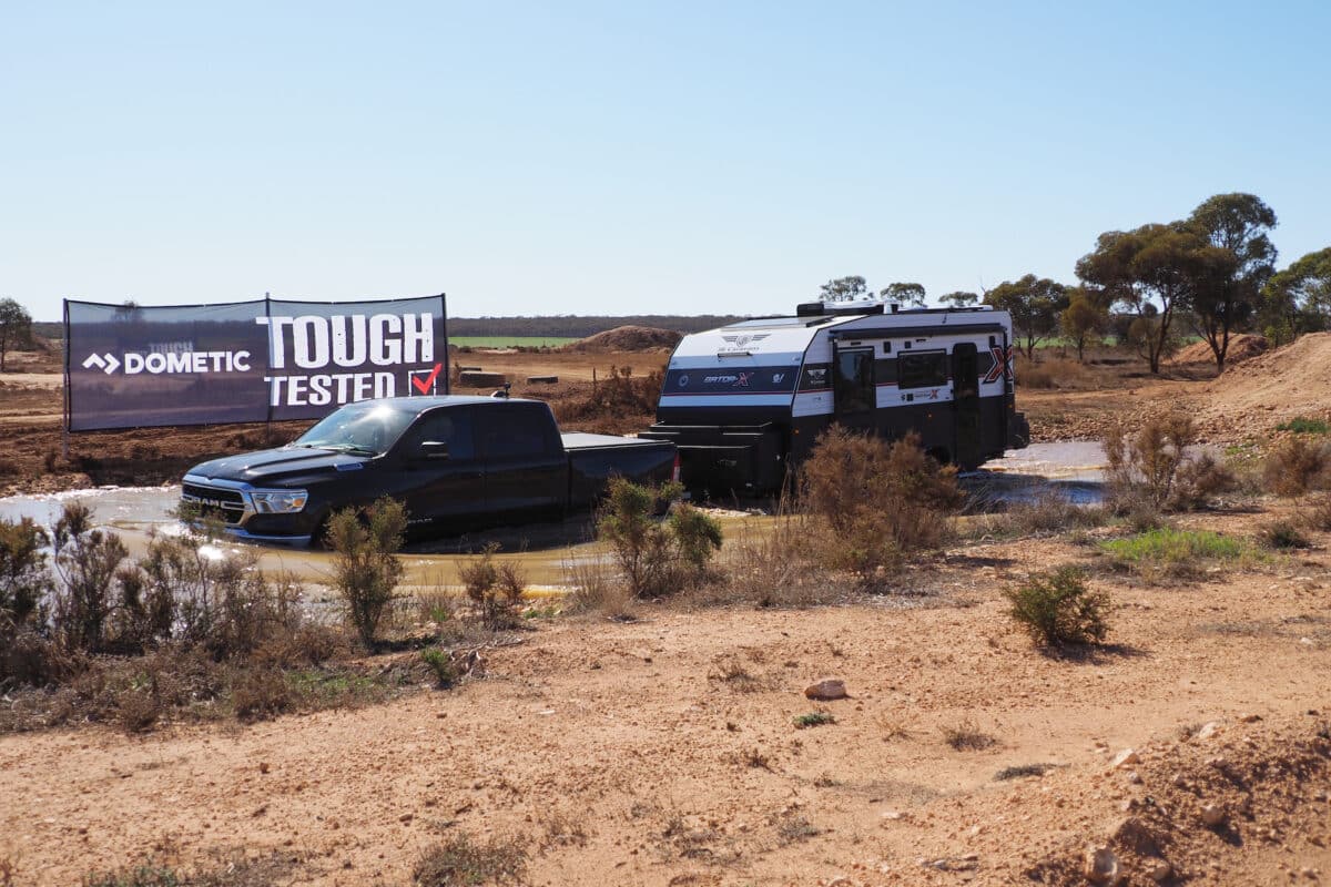 The JB Gator X ev tackles a water crossing