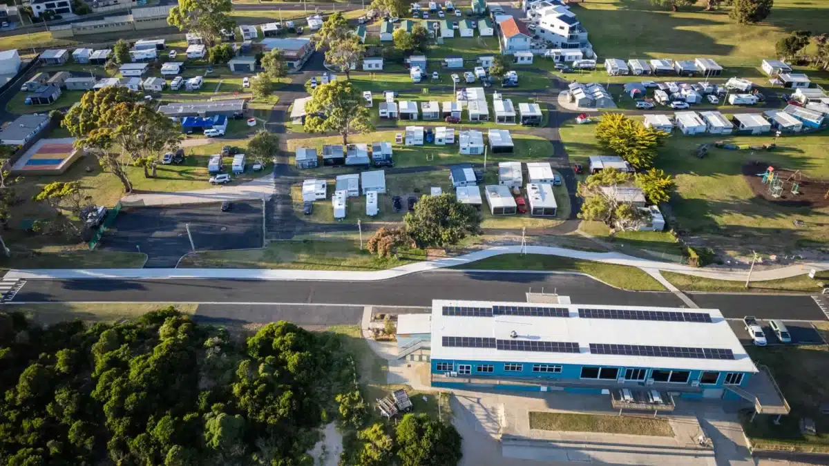 Aerial view of closely spaced sites at a busy Australian holiday park