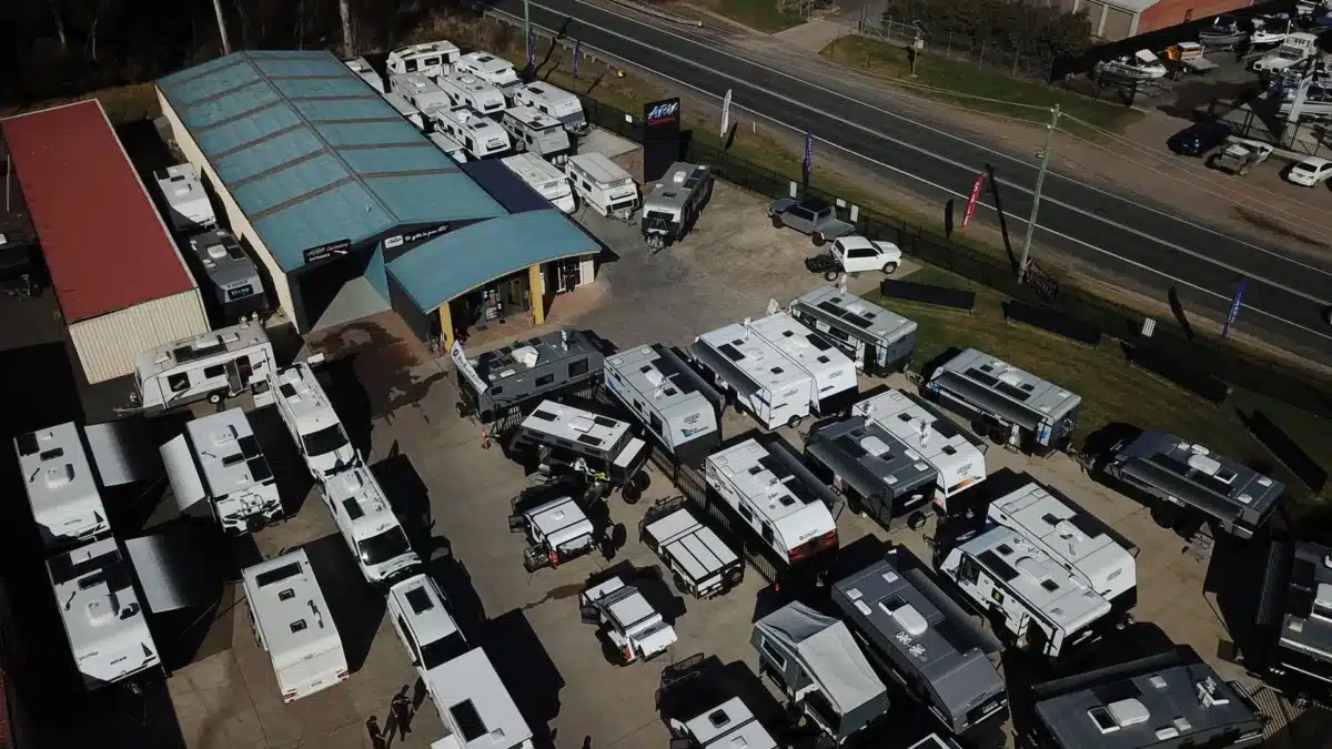 Aerial view of multiple caravans parked at a site in Australia