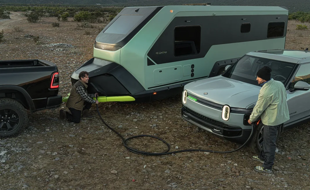 evotrex-pg5-rv-trailer-ev-charging-off-grid Evotrex PG5 RV trailer supplying power to an electric vehicle at an off-grid campsite
