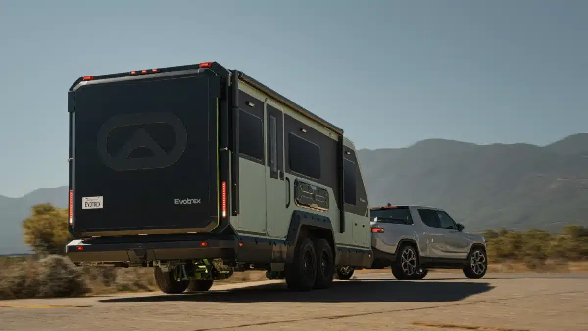 Rear view of the Evotrex PG5 RV trailer being towed on an open road