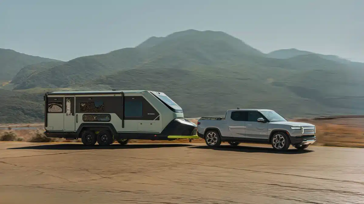 Rear view of the Evotrex PG5 RV trailer being towed on an open road