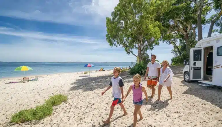 Family enjoying a summer caravan holiday on the Australian coast