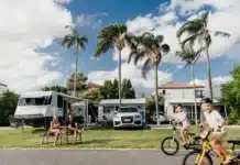 Children riding bikes through an Australian caravan park during a family holiday