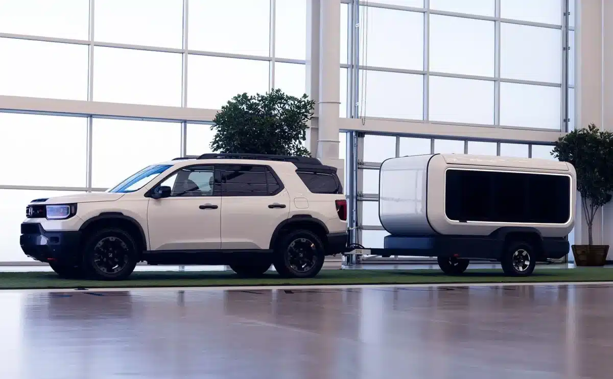 Compact Honda Base Station travel trailer prototype being towed with roof closed