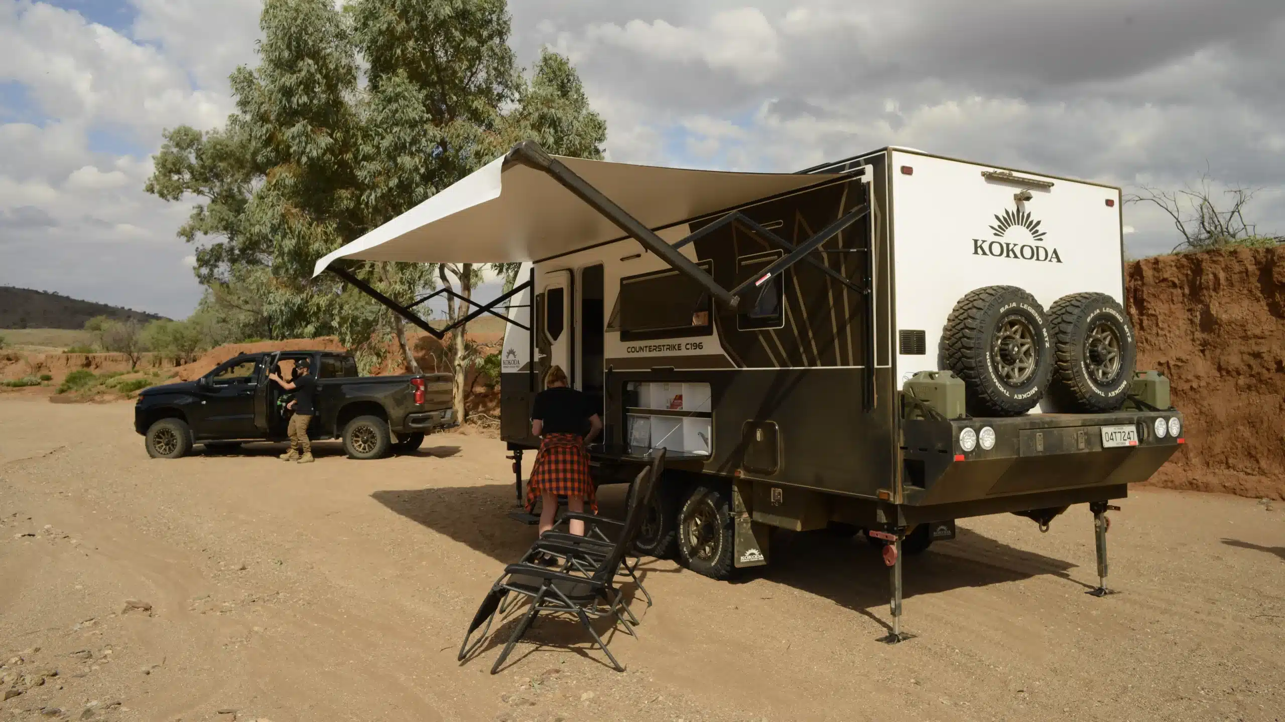 off-grid caravan set up in dusty scene