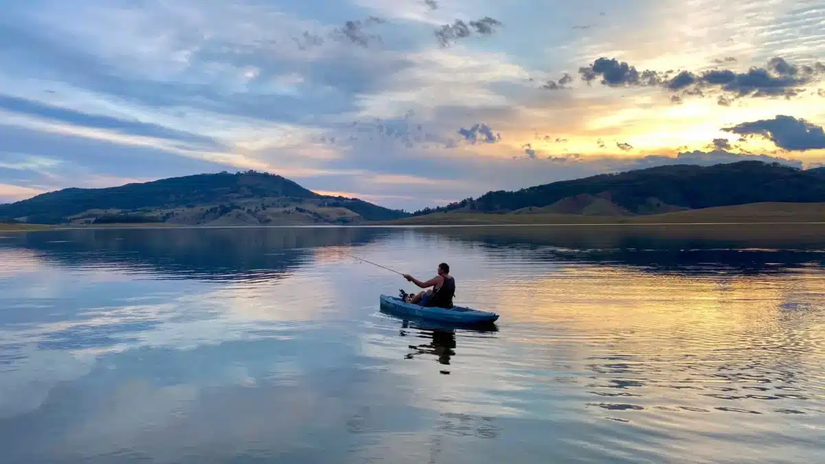 Kayaking on calm freshwater at Lake St Clair NSW near the campground