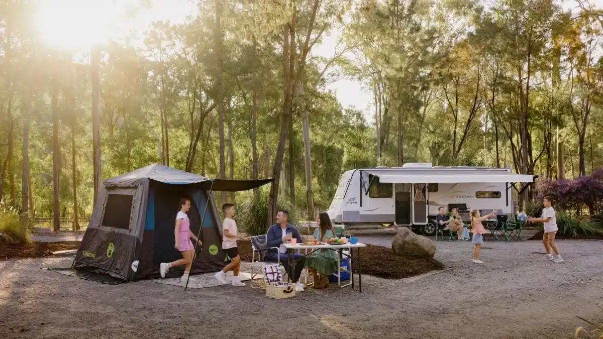 Families and travellers sharing space at a modern Australian caravan park