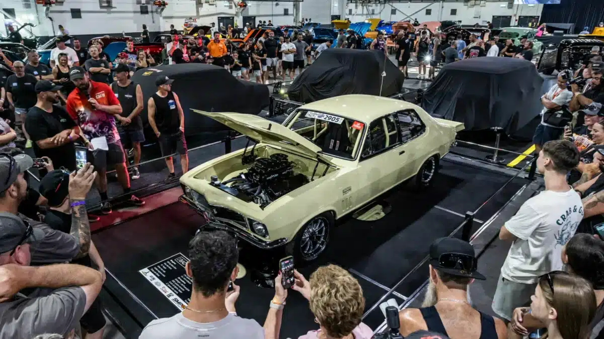 Crowd gathered around a classic car at a Summernats car show in Canberra