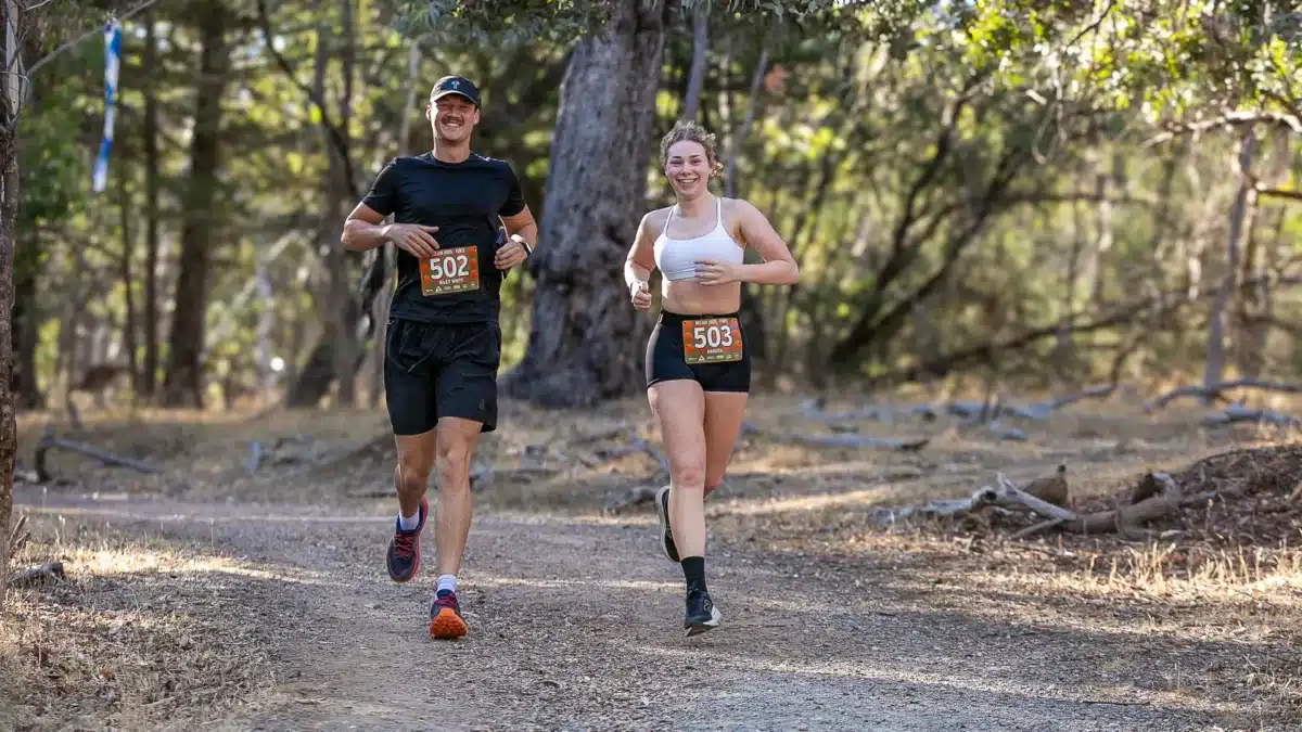 Runners competing on a bush trail during a fitness event near Adelaide