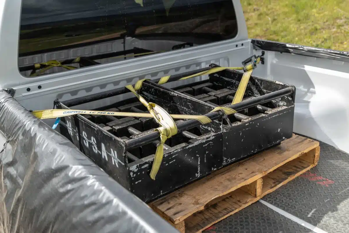 Nissan Navara tub carrying secured touring equipment