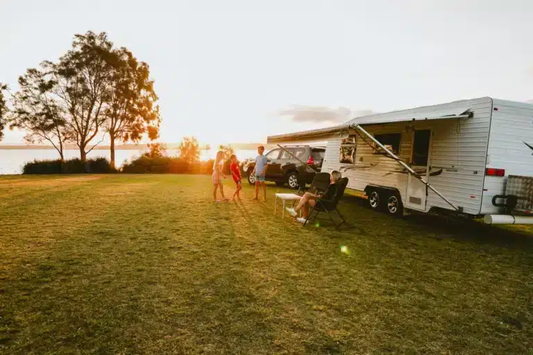 Family playing outside with sunsetting in background