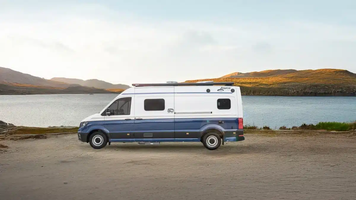 Jayco campervan parked beside a remote Australian waterway during a regional road trip