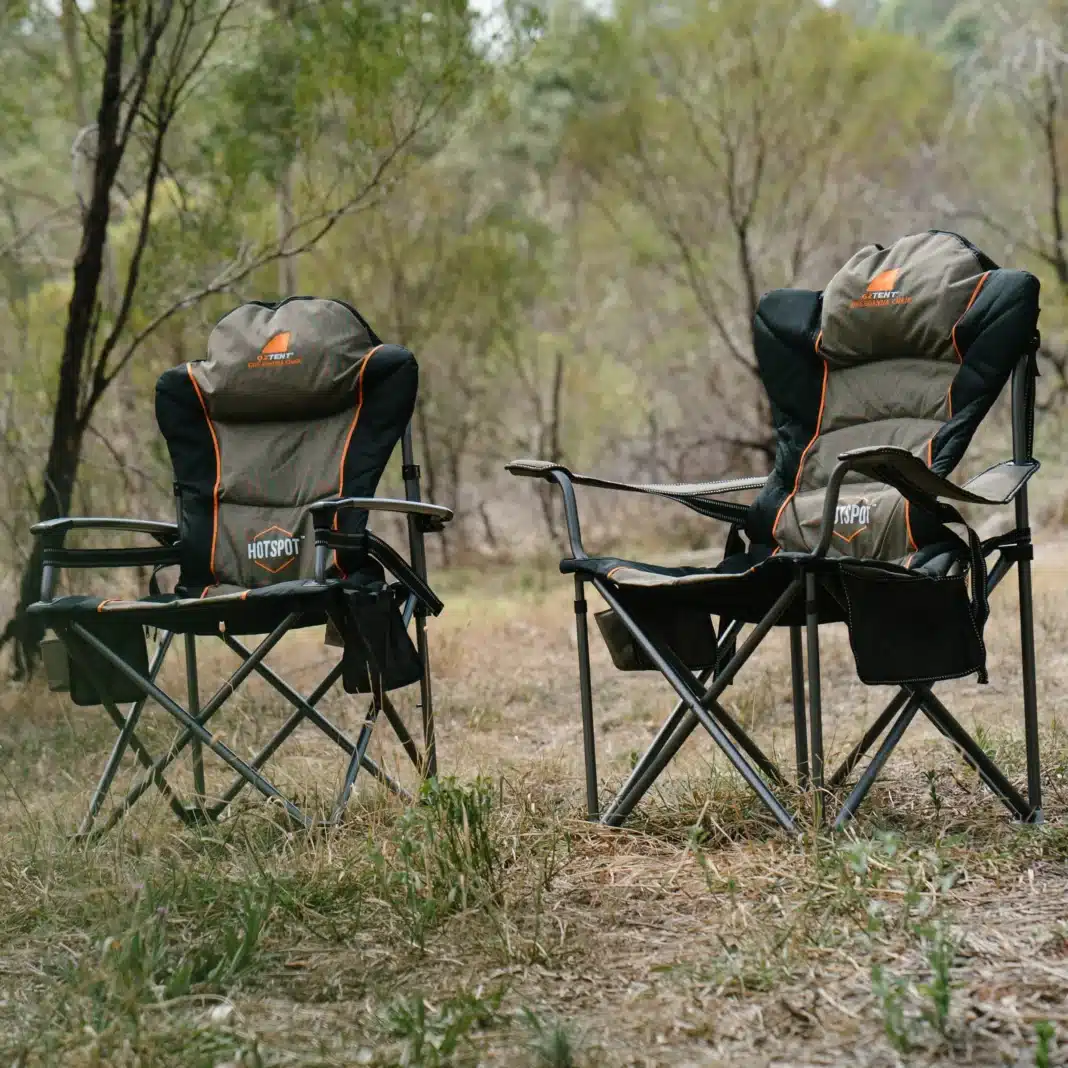 two camp chairs sitting in forrest