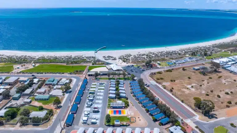 Aerial view of a regional coastal caravan park in Australia