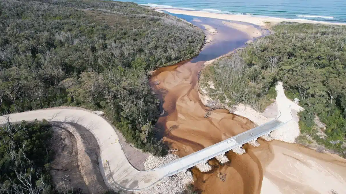 Aerial view of the rebuilt Thurra River bridge in Croajingolong National Park following bushfire damage