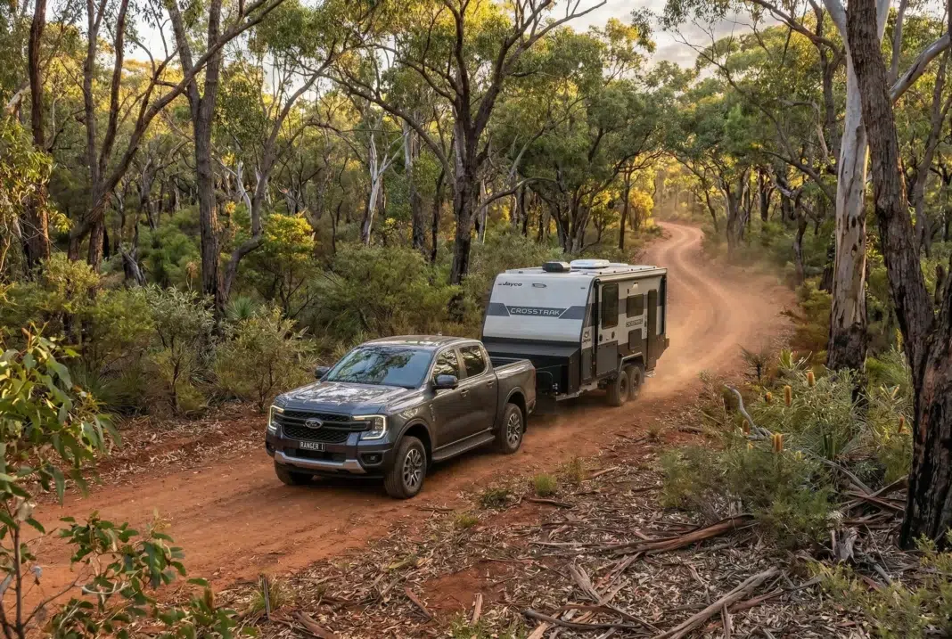 Ford Ranger towing a Jayco caravan on an Australian dirt road, reflecting strong ute sales in January 2026 vehicle data.