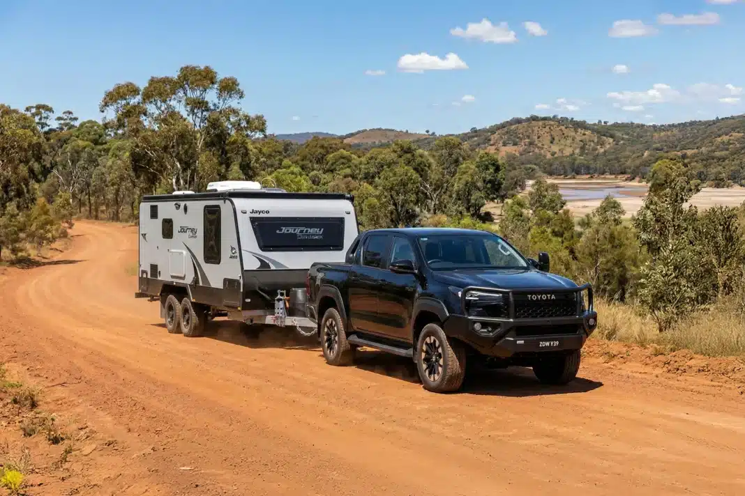 Toyota HiLux towing a Jayco caravan in regional Australia, highlighting strong dual-cab ute sales in January 2026.