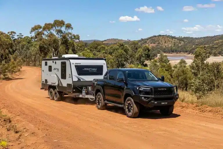 Toyota HiLux towing a Jayco caravan in regional Australia, highlighting strong dual-cab ute sales in January 2026.