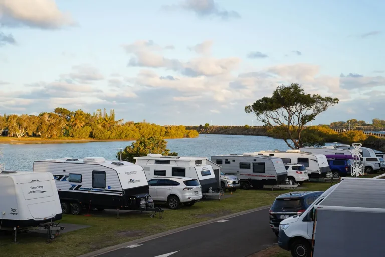 Caravans parked at a riverside caravan park in Ballina NSW
