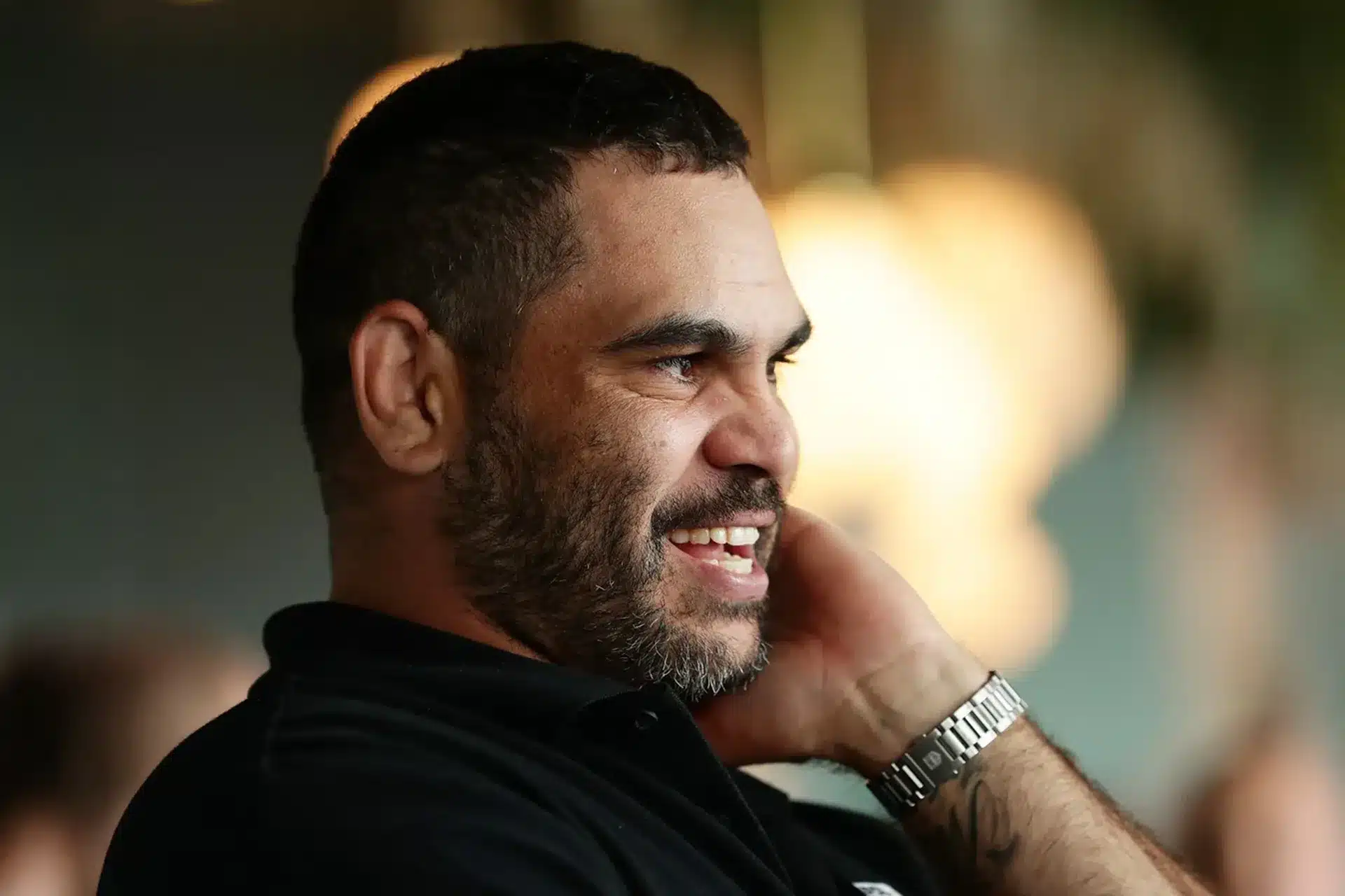 Greg Inglis smiling during a media appearance as the former Australian rugby league player.