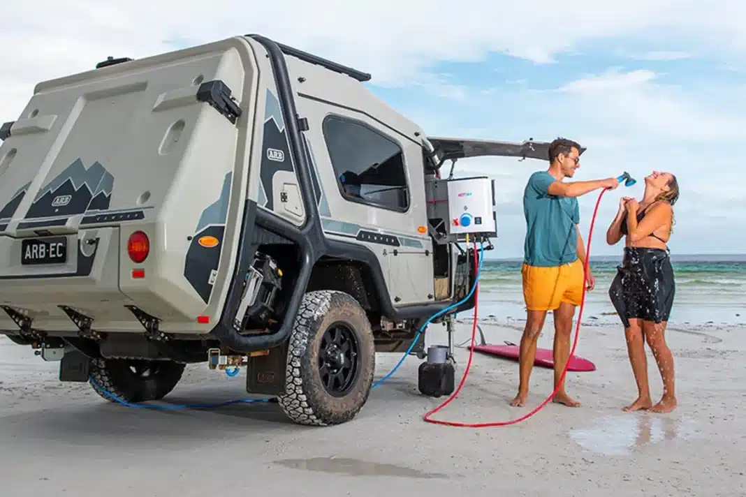 Joolca HOTTAP V2 hot water system used beside caravan for beach shower setup