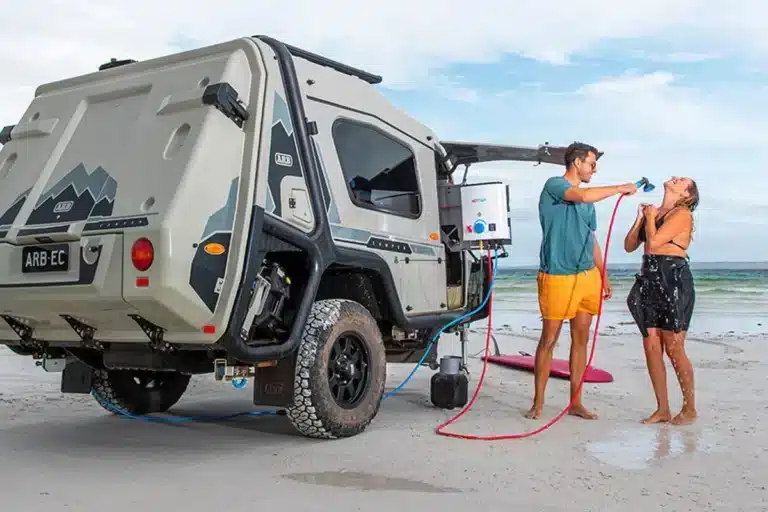 Joolca HOTTAP V2 hot water system used beside caravan for beach shower setup