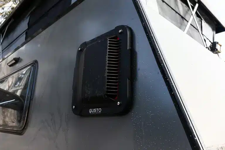 slim dust reduction system on side of dirty rv camper