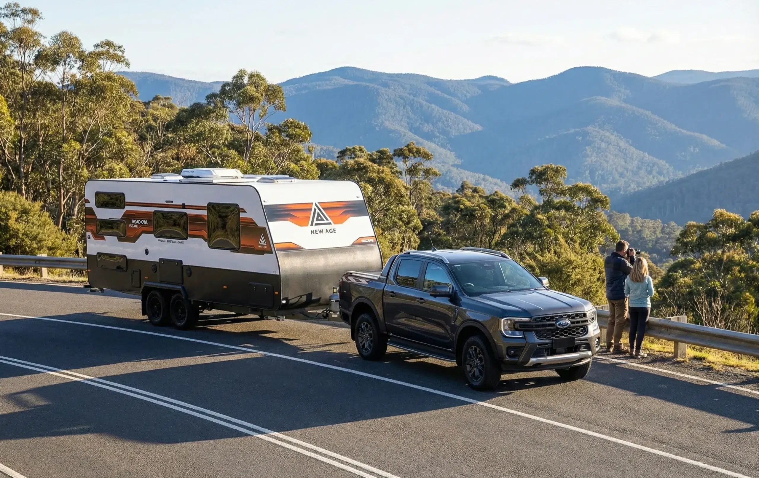 New Age Caravans Road Owl Escape caravan being towed by a Ford Ranger on a scenic mountain road lookout.