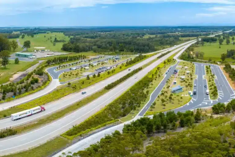 Aerial view of upgraded highway rest stop with caravan parking areas in Australia
