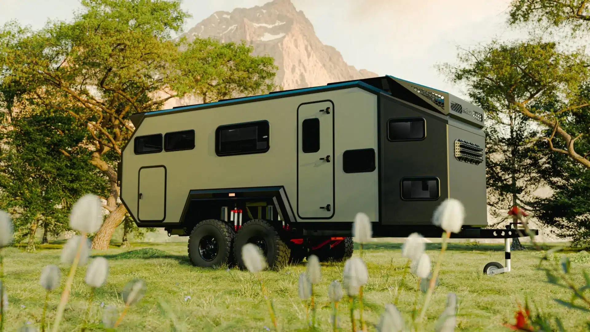 bruder-exp-10-off-road-family-camper-trailer Bruder Caravans EXp10 flagship model sitting in grass field