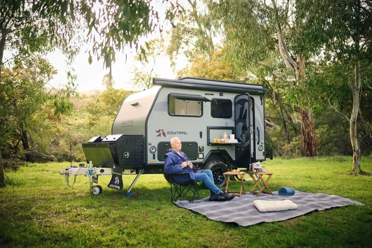 outside small caravan setup enjoying nature