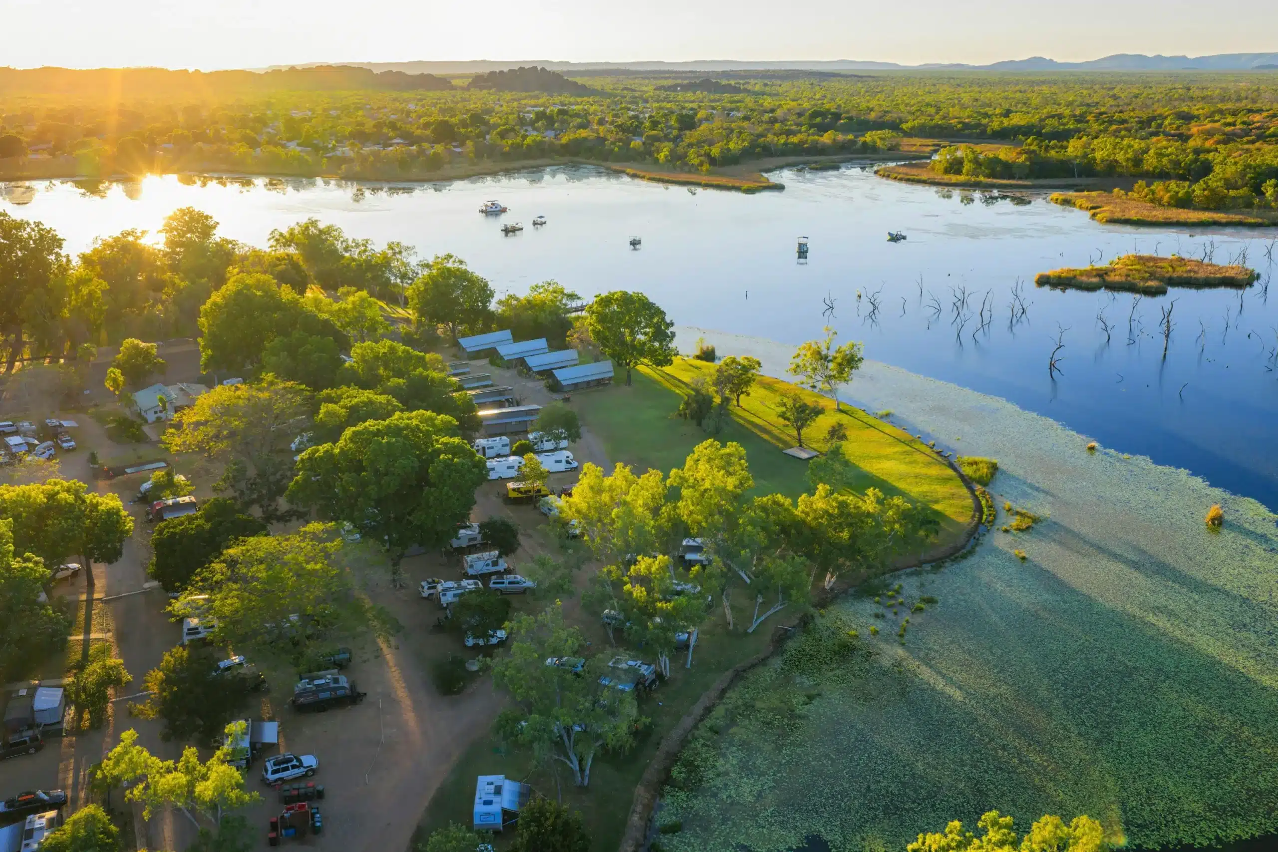 Kimberleyland Waterfront Holiday Park at Kununurra with powered sites under boab trees alongside Lily Creek Lagoon in the East Kimberley, Western Australia.
