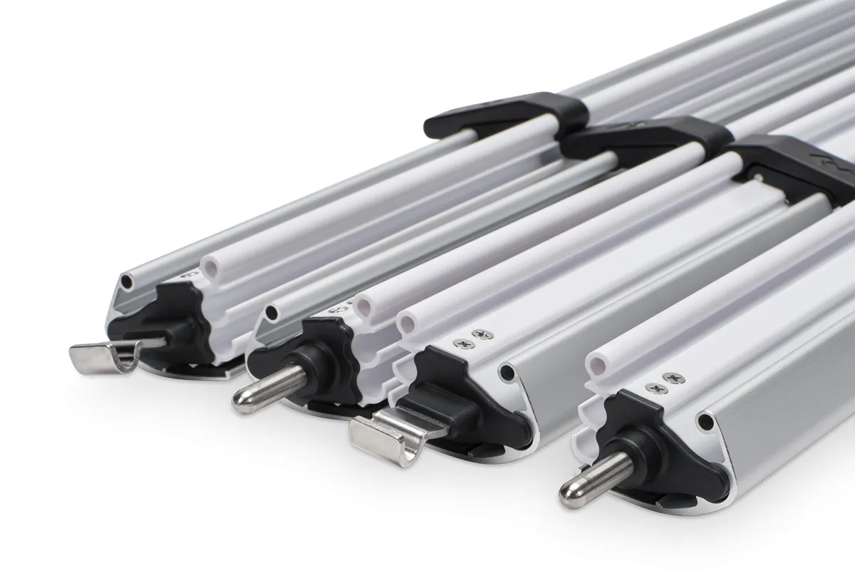 Close-up of Dometic anti-flap kit aluminium rafter arms showing the internal locking mechanism and stainless steel pin fittings