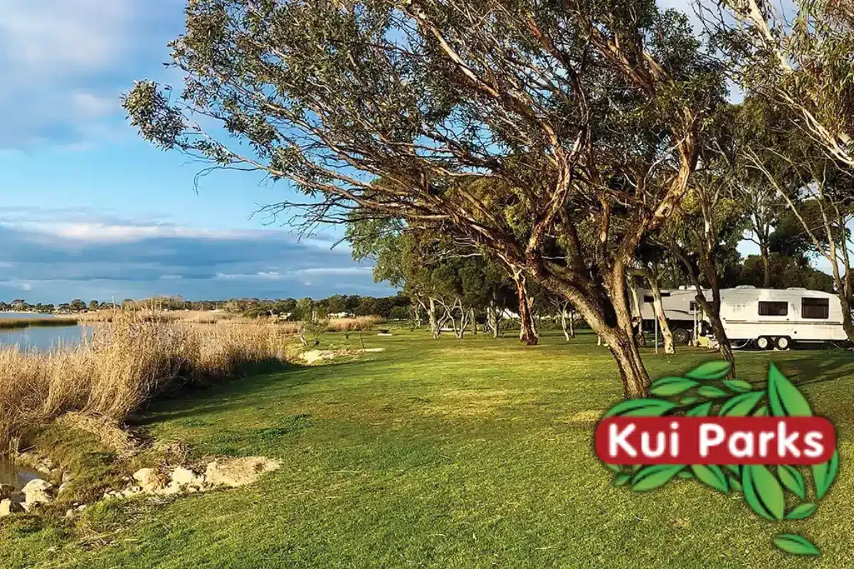 kui caravan park with caravan by river with grass