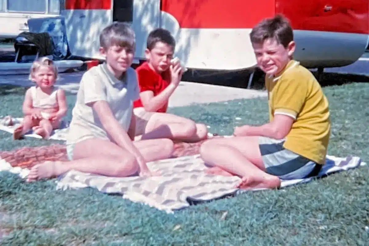 kids having snack on towels while carvanning