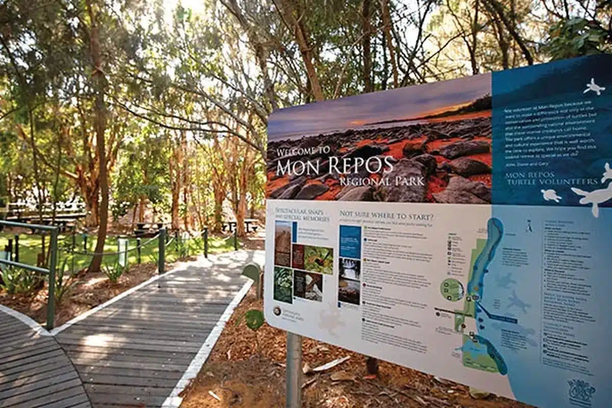 Welcome sign and timber boardwalk at Mon Repos Regional Park near Bundaberg, a short day trip from Woodgate Beach and home to one of Australia's most significant loggerhead turtle nesting sites